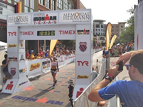 Person crossing the finish line at the Ironman Texas
